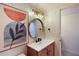 Stylish bathroom featuring a wood vanity, modern faucet, and decoratively tiled walls at 115 Tomoka Trl # 115, Longwood, FL 32779
