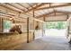 Lovely horse barn featuring a concrete floor, wooden stalls, and good ventilation for equine comfort at 115 Tomoka Trl # 115, Longwood, FL 32779