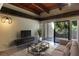 Comfortable living room with sleek furniture, modern lighting and sliding doors to outdoor patio at 115 Tomoka Trl # 115, Longwood, FL 32779
