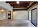 Open-concept living room with high ceilings, tile floors, modern lighting, and outdoor access at 115 Tomoka Trl # 115, Longwood, FL 32779