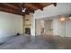 Spacious living room features a stone fireplace, tile floors, exposed beams and high ceilings at 115 Tomoka Trl # 115, Longwood, FL 32779