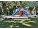 Community playground featuring a slide and climbing structure, perfect for recreation and enjoyment at 115 Tomoka Trl # 115, Longwood, FL 32779