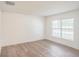 Bright bedroom with modern flooring, a large window, and ample natural light at 117 Sanderling Dr, Haines City, FL 33844