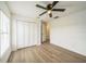 This bright bedroom features new flooring, neutral walls and ceiling fan for extra comfort at 117 Sanderling Dr, Haines City, FL 33844