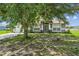 Charming home with mature tree in the front yard providing shade and curb appeal at 117 Sanderling Dr, Haines City, FL 33844
