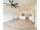 Open-concept living room flows into a modern kitchen with an island and recessed lighting at 117 Sanderling Dr, Haines City, FL 33844