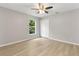 Bright bedroom featuring a ceiling fan, a closet, and light wood flooring at 1195 Tivoli Dr, Deltona, FL 32725
