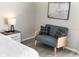 Cozy bedroom featuring a loveseat with natural light coming through a large window at 1195 Tivoli Dr, Deltona, FL 32725