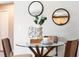 Chic dining area with modern table setting, decorative mirrors, and comfortable seating at 1195 Tivoli Dr, Deltona, FL 32725