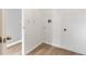 Bright laundry room with modern flooring and convenient hookups for washer and dryer at 1195 Tivoli Dr, Deltona, FL 32725