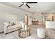 Inviting living room area features modern furniture, wood floors, and open layout at 1195 Tivoli Dr, Deltona, FL 32725
