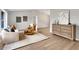 Bright living room showcasing wood flooring, neutral tones, and stylish furniture pieces at 1195 Tivoli Dr, Deltona, FL 32725