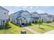 View of multiple modern homes with well-maintained lawns and landscaping in a Gathering-friendly neighborhood at 12133 Bracco St, Winter Garden, FL 34787