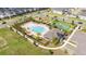 Overhead image of the community pool with chairs, umbrellas, and a covered recreation area at 12133 Bracco St, Winter Garden, FL 34787