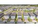 Wide aerial shot showing a community with rows of homes, a pool, and a lake at 12133 Bracco St, Winter Garden, FL 34787
