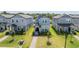 Aerial view of a light blue two-story home with well-kept lawn and landscaping at 12133 Bracco St, Winter Garden, FL 34787