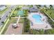 Aerial view featuring a swimming pool, playground, and basketball court at 12133 Bracco St, Winter Garden, FL 34787
