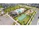 Overhead photo showing the swimming pool, clubhouse, tennis court, playground, and parking lot at 12133 Bracco St, Winter Garden, FL 34787