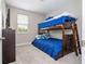 Bedroom with a wooden bunk bed, a window, and carpeting at 12133 Bracco St, Winter Garden, FL 34787