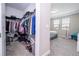 Open walk-in closet leading into a bright bedroom featuring plush carpet at 12133 Bracco St, Winter Garden, FL 34787