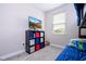 Well-lit bedroom includes a storage system, bunk bed and bright window with natural light at 12133 Bracco St, Winter Garden, FL 34787