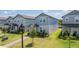 Charming new construction two-story home with light blue siding, manicured lawn and sidewalks at 12133 Bracco St, Winter Garden, FL 34787
