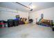 Spacious garage with epoxy flooring, white walls, and overhead lighting at 12133 Bracco St, Winter Garden, FL 34787