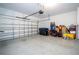 Large garage with epoxy flooring, white walls, and an open garage door at 12133 Bracco St, Winter Garden, FL 34787