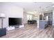 Open living area with hardwood floors, flowing into kitchen and dining, great for entertaining at 12133 Bracco St, Winter Garden, FL 34787