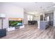 Open living area with hardwood floors, flowing into kitchen and dining, great for entertaining at 12133 Bracco St, Winter Garden, FL 34787