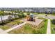 Playground with slide, climbing structures, and seating near the pool at 12133 Bracco St, Winter Garden, FL 34787