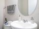 Close up view of the stylish pedestal sink in the powder room at 12133 Bracco St, Winter Garden, FL 34787