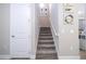 Carpeted staircase leading to the upper level of the home at 12133 Bracco St, Winter Garden, FL 34787