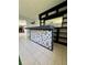 Stylish bar with unique mosaic detailing and built-in shelving, perfect for entertaining guests in a modern setting at 1219 Serissa Ct, Orlando, FL 32818
