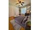 Comfortable bedroom with ample natural light, featuring plush bedding and organized storage with mirrored closet doors at 1219 Serissa Ct, Orlando, FL 32818