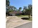 Charming single-story home featuring well-maintained landscaping, a two car garage, and inviting curb appeal at 1219 Serissa Ct, Orlando, FL 32818