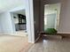 Open hallway featuring tile and carpeted flooring, connecting the living spaces for seamless flow and accessibility at 1219 Serissa Ct, Orlando, FL 32818
