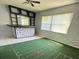 Living room with an entertainment center and a football field painted on the floor at 1219 Serissa Ct, Orlando, FL 32818