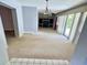 Open living room space with ceiling fan, natural light, and easy access to the outside at 1219 Serissa Ct, Orlando, FL 32818