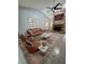 Modern living room with a striking brick fireplace, high ceilings, and comfortable leather furniture for relaxation at 1219 Serissa Ct, Orlando, FL 32818
