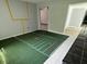 Living room with a football field painted on the floor and an adjoining room at 1219 Serissa Ct, Orlando, FL 32818