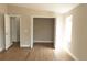 Bedroom showcasing an ample closet space, and an open door frame into an adjacent room at 1220 Zapata Pl, Lady Lake, FL 32159