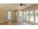 Open-concept living room featuring hardwood floors, plenty of natural light, and neutral paint at 1220 Zapata Pl, Lady Lake, FL 32159
