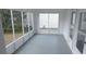 Enclosed sunroom with screen windows and white trim at 1220 Zapata Pl, Lady Lake, FL 32159