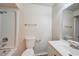 Bathroom featuring a bathtub and shower, toilet, vanity and mirror with chrome hardware at 14 Cyclops Dr, Apopka, FL 32703