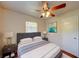 Well lit bedroom with ceiling fan, hardwood floors, and and night stands at 14 Cyclops Dr, Apopka, FL 32703