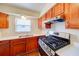 Well-appointed kitchen with stainless steel appliances, granite countertops, and ample cabinet space at 14 Cyclops Dr, Apopka, FL 32703