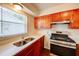 Modern kitchen features stainless steel appliances and beautiful countertops, perfect for cooking and entertaining at 14 Cyclops Dr, Apopka, FL 32703