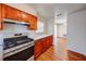 Well-lit kitchen featuring stainless steel appliances, warm wood cabinetry, and a countertop at 14 Cyclops Dr, Apopka, FL 32703