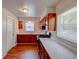 Well-lit kitchen with stainless steel appliances, ample counter space, and rich wood cabinetry at 14 Cyclops Dr, Apopka, FL 32703